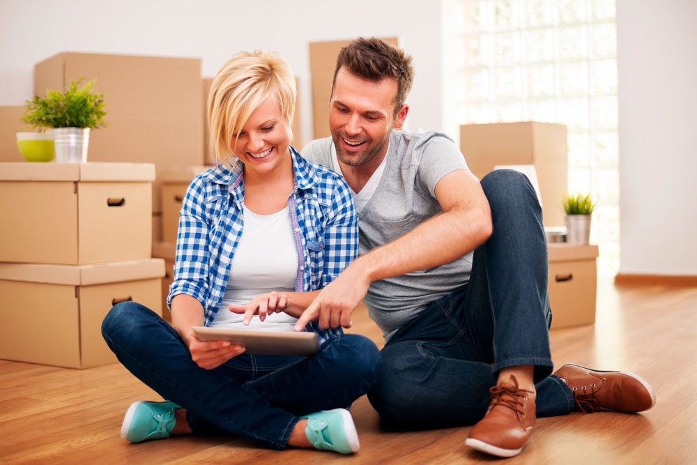 Couple using a tablet while moving.