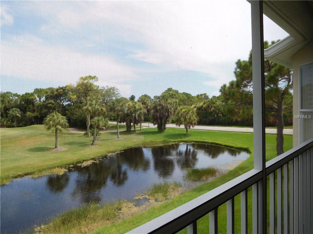 View of pond and golf course from balcony.