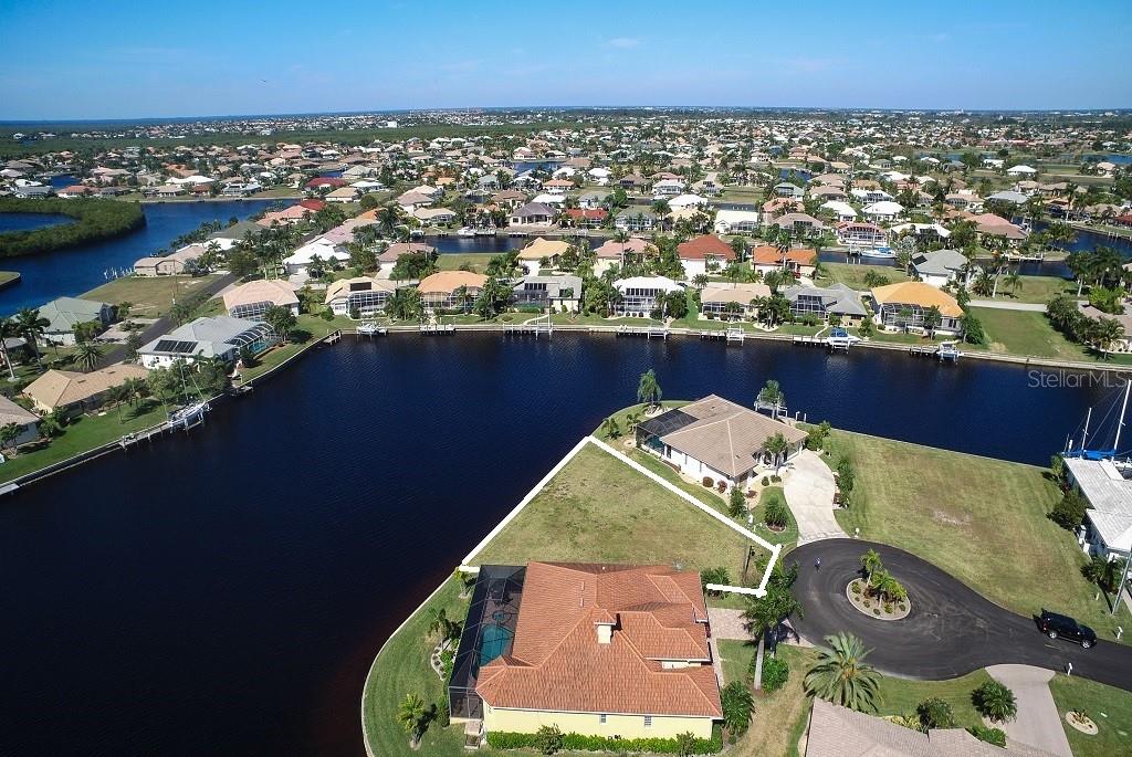 Aerial view of a waterfront property.