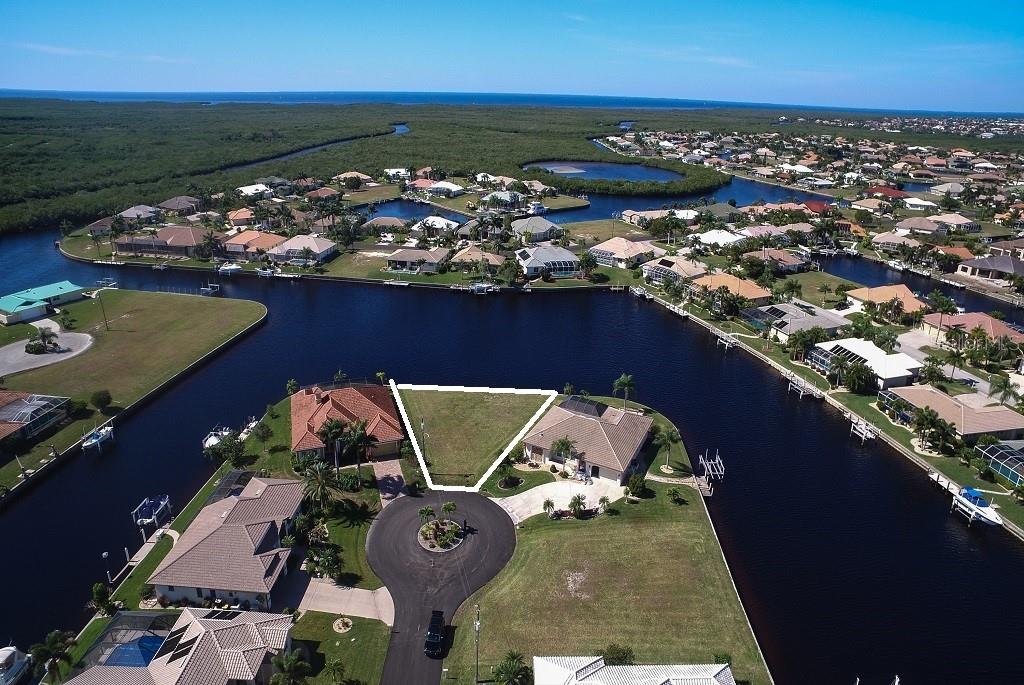 Aerial view of waterfront vacant lot.