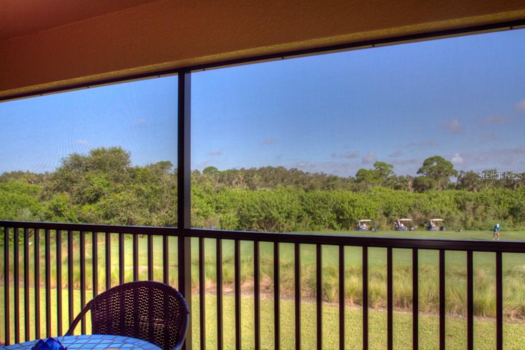 Golf course view from a screened porch.