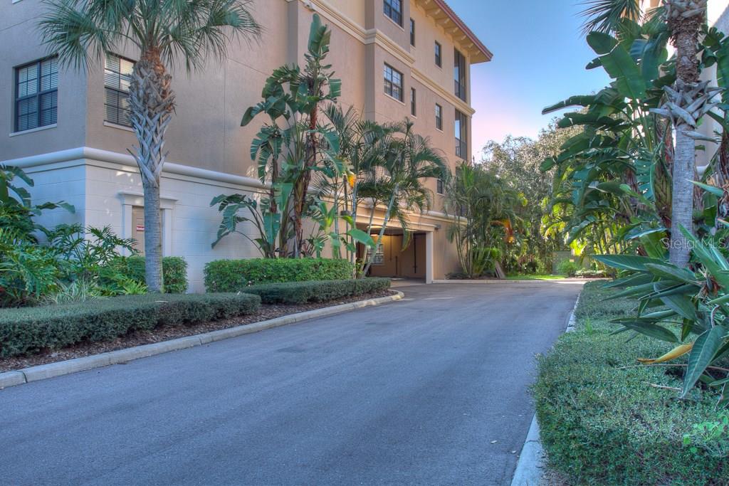 Driveway leading to a condo building.