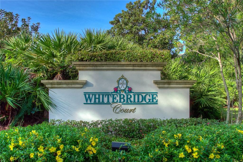 Whitebridge Court sign with green foliage.