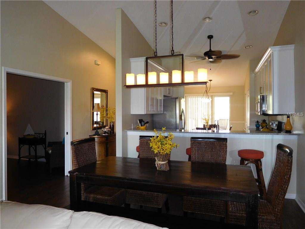 Dining room with wooden table and chairs.