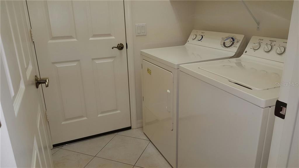 White washer and dryer in laundry room.