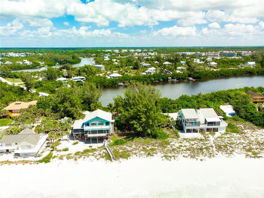 Aerial view of beach houses and canal.