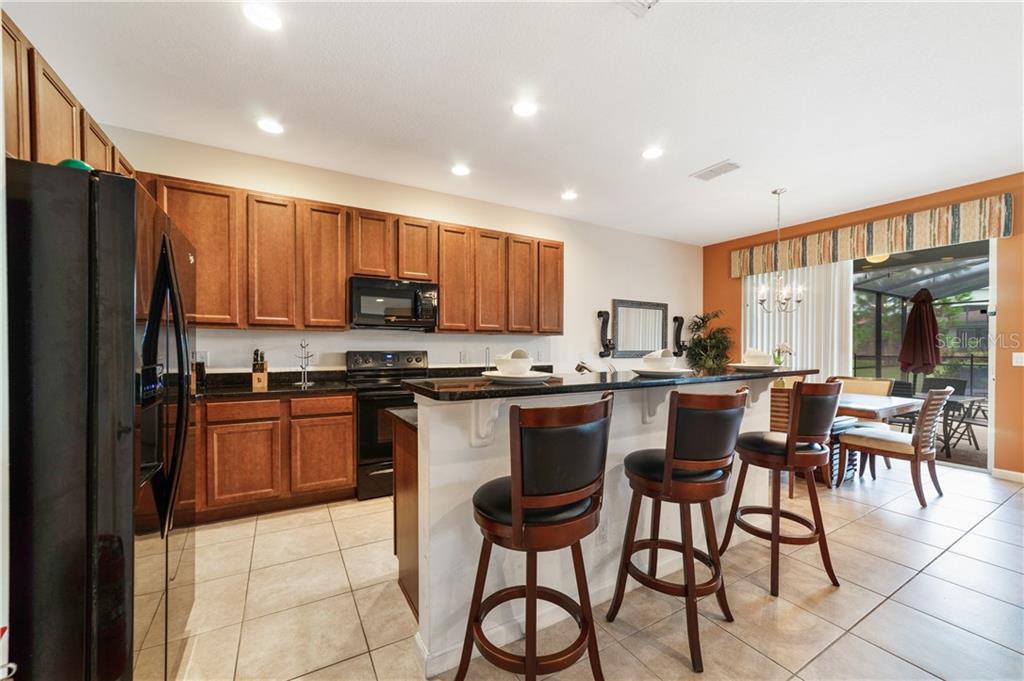 Kitchen with island and bar stools.