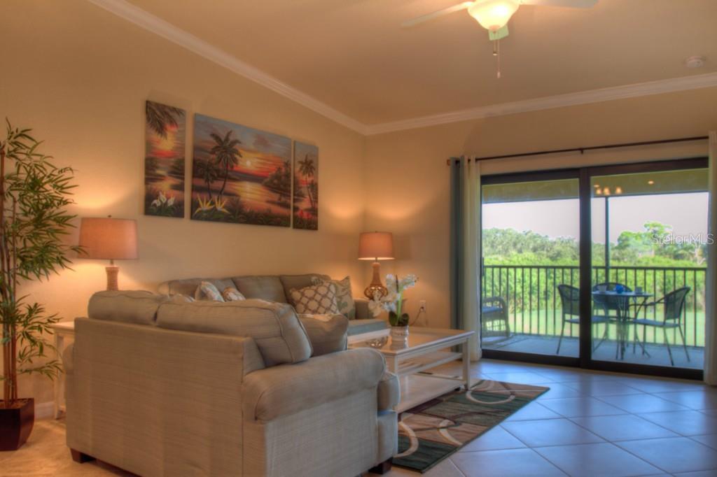 Living room with couch and patio view.