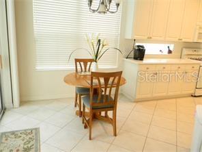 A small kitchen nook with a table and chairs.