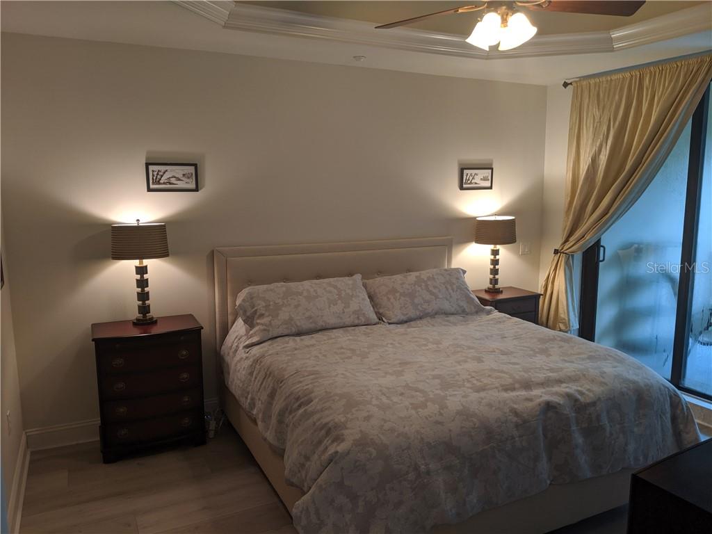 Bedroom with a king-size bed and nightstand.