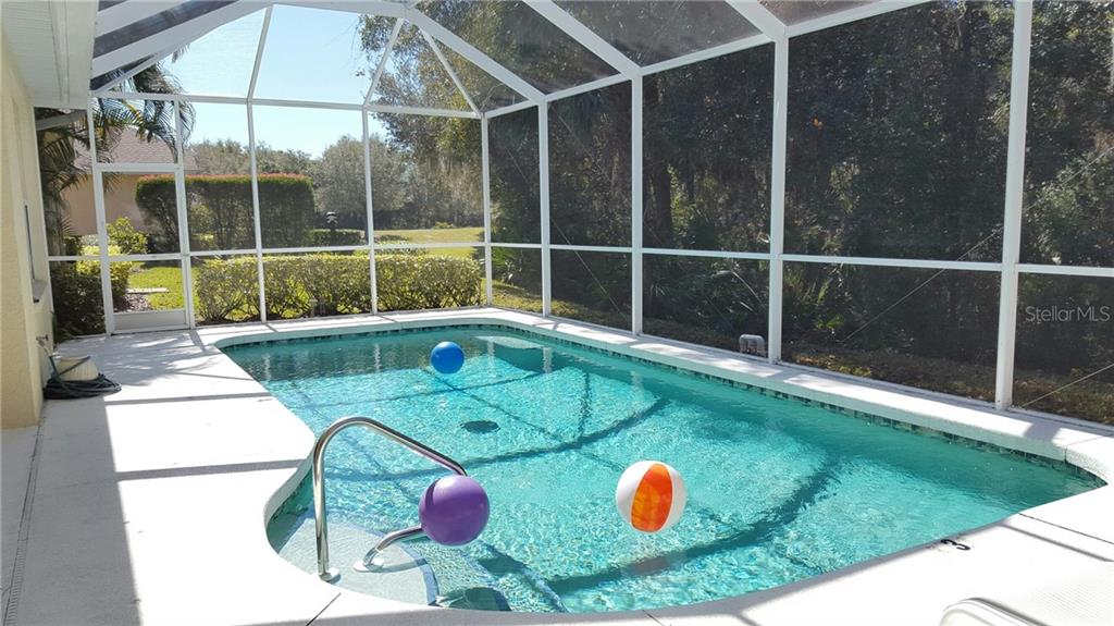 Enclosed pool with blue and orange balls.