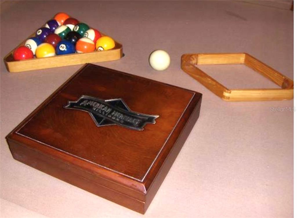 Pool balls, wooden box, and a rack.