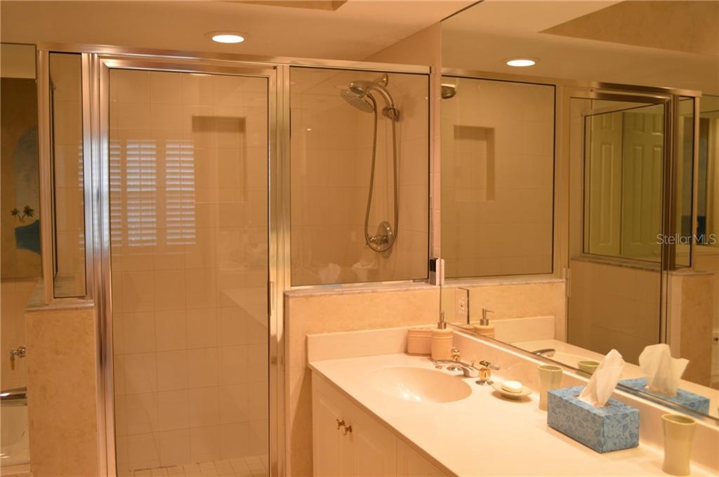 Bathroom with shower and sink.