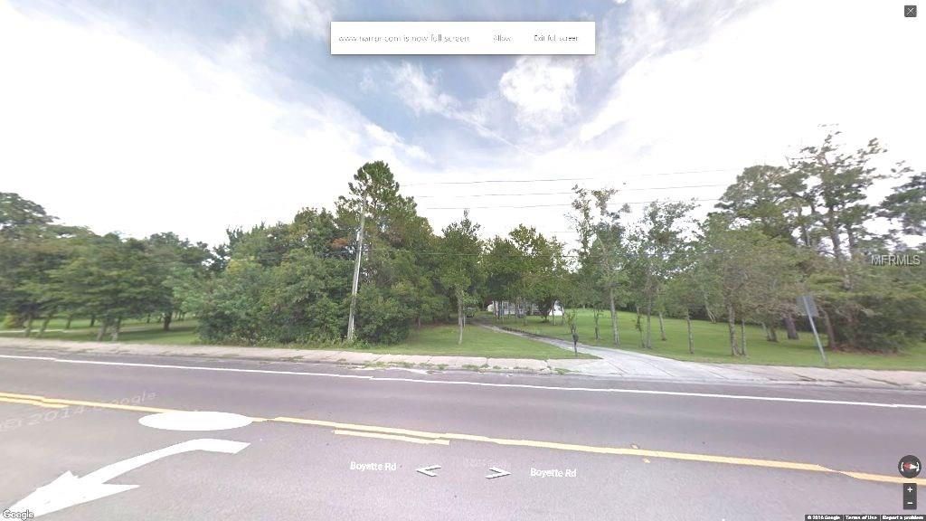 Street view of a road with trees.