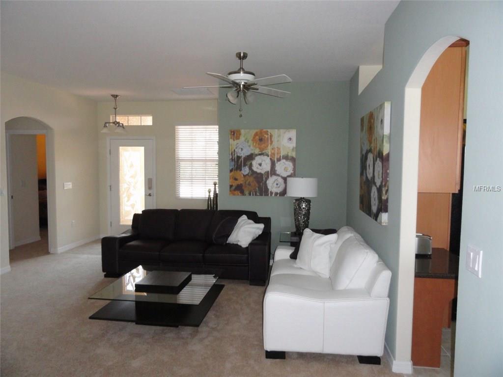 Living room with white and black couches.