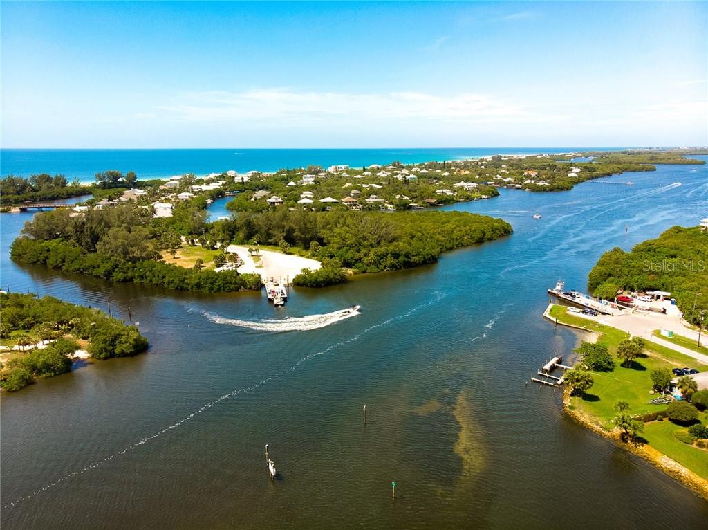 Aerial view of a boat launch in a bay.