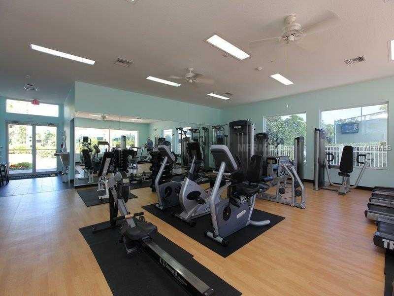 A well-equipped gym with cardio machines.