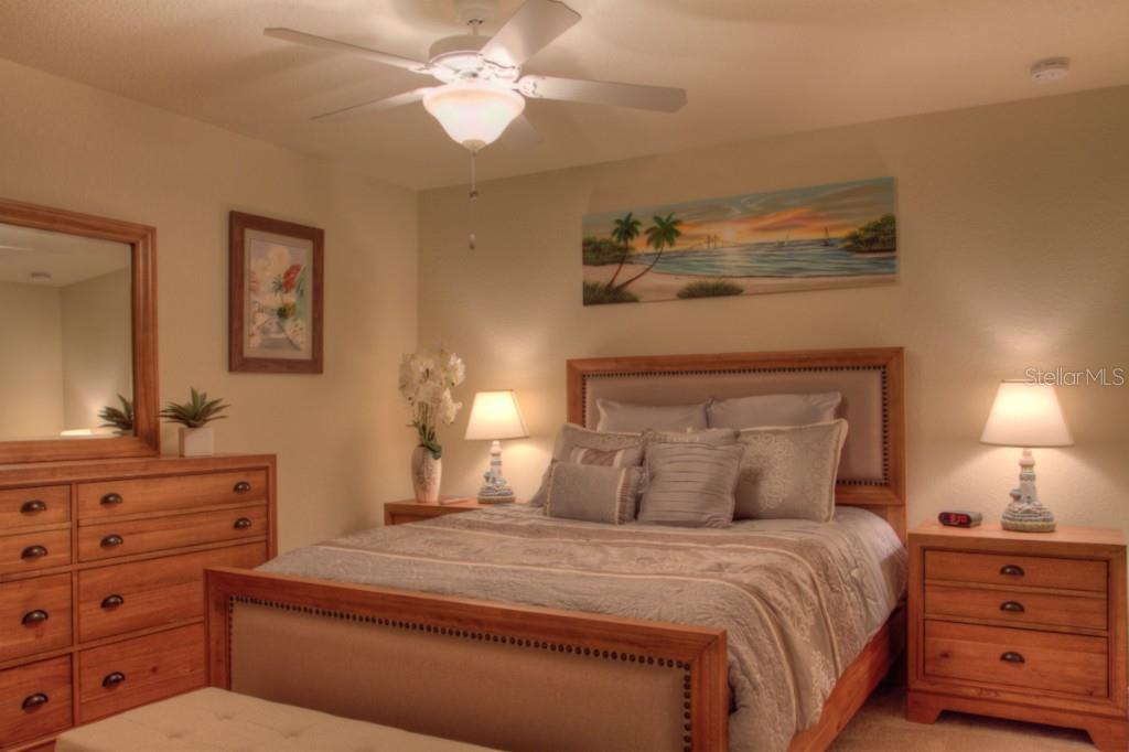 Bedroom with a bed and a dresser.