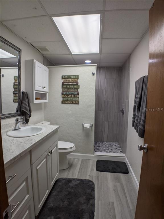 White bathroom with shower and vanity.