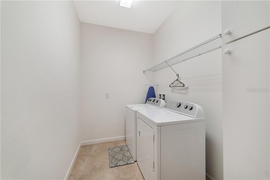 White washer and dryer in laundry room.