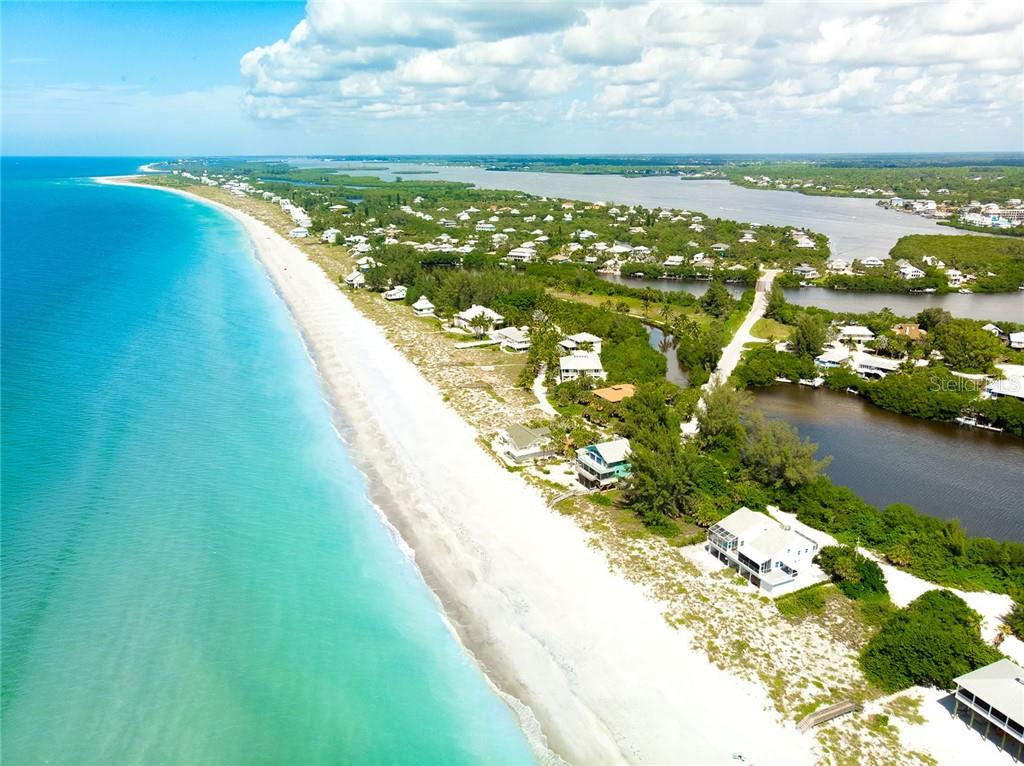 Aerial view of beach houses and ocean.