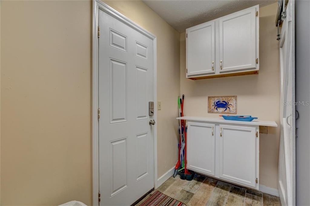 White cabinets and door in a kitchen.