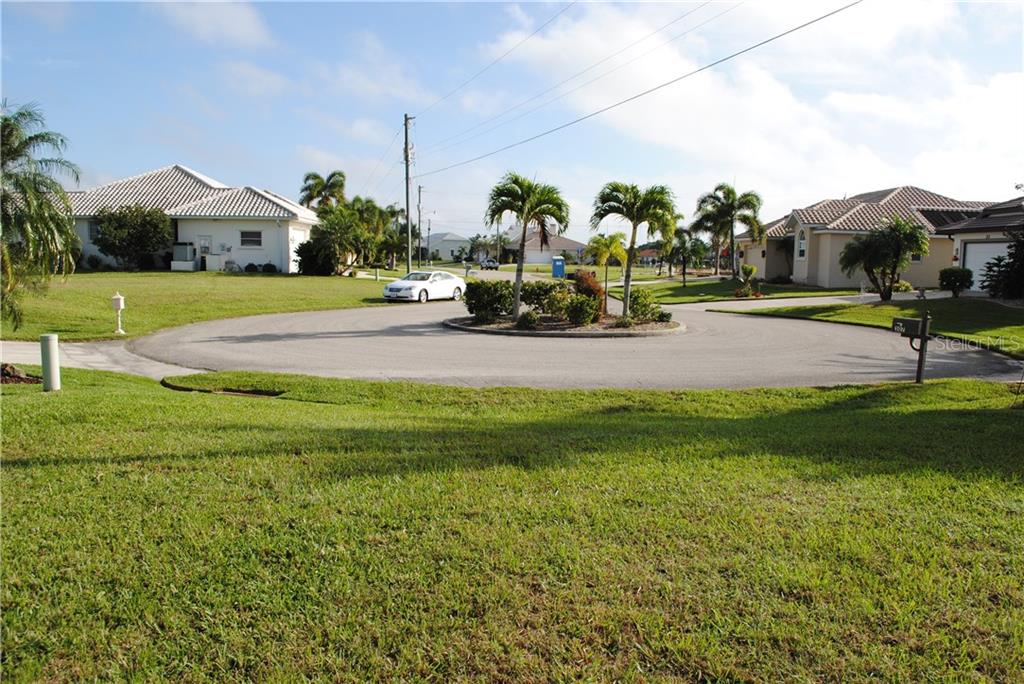 Empty lot in a suburban neighborhood.