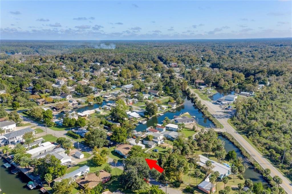 Aerial view of a waterfront property.