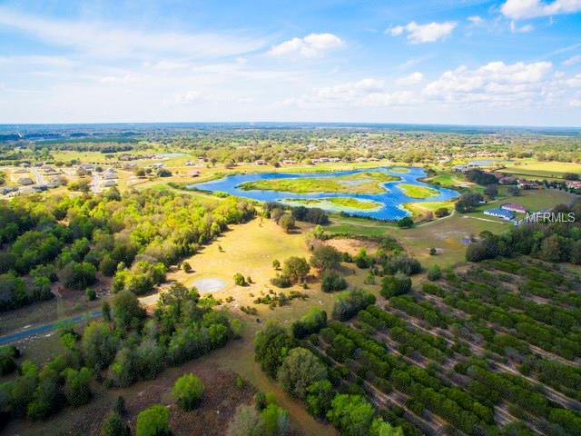 Aerial view of a lake and farm