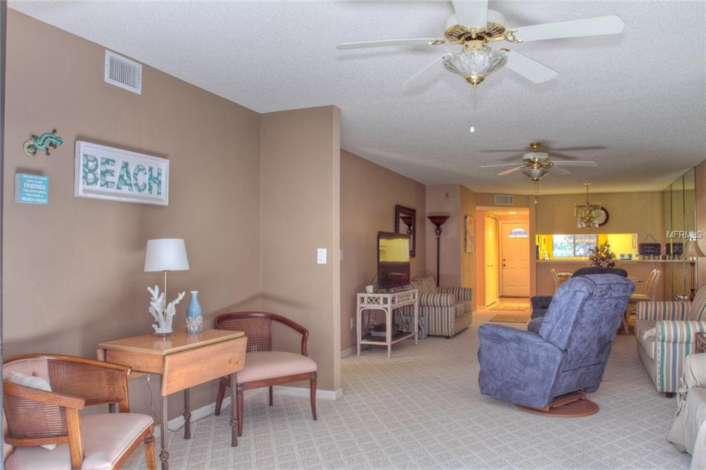 Living room with beach decor and a couch.