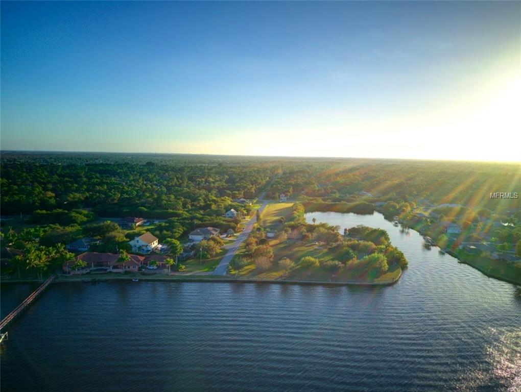 Aerial view of houses on a waterfront.