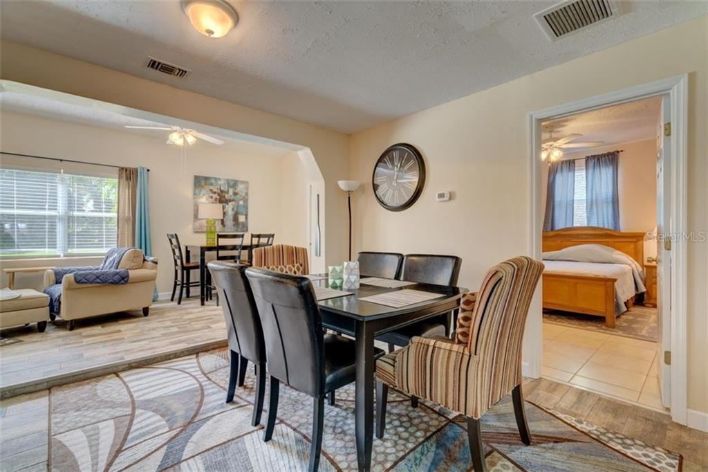 Dining room with black table and chairs.