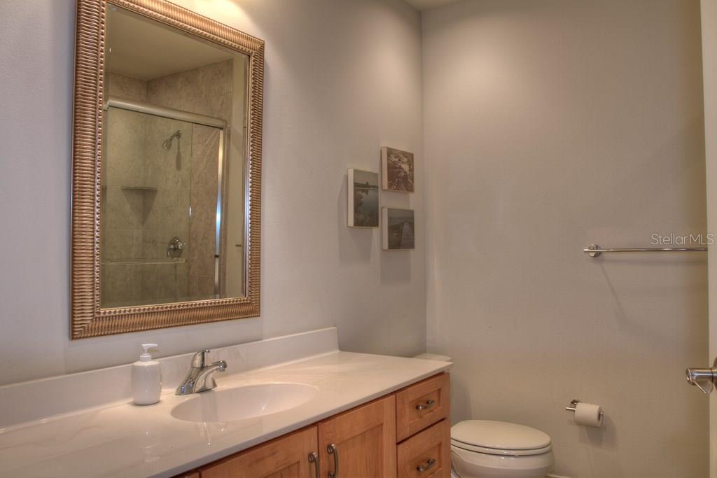 Bathroom with white sink and toilet.