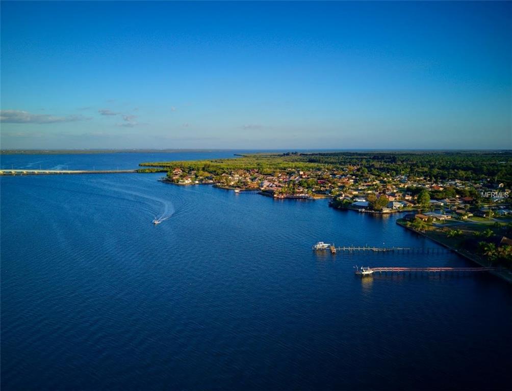 Aerial view of a coastal town with boats.