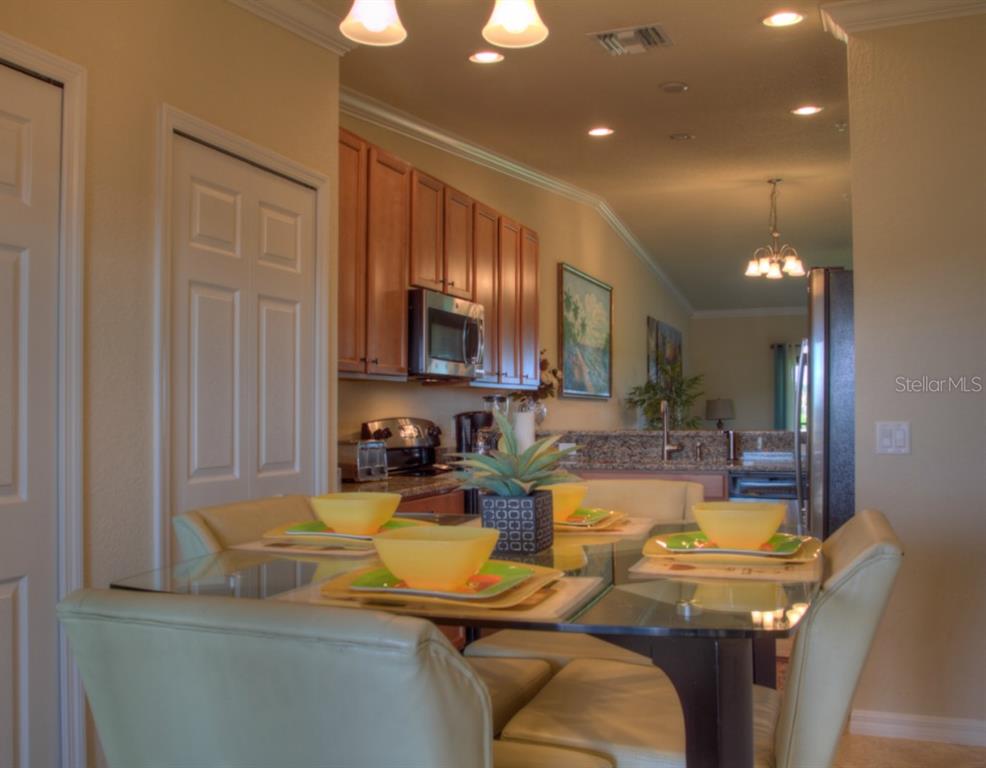 Dining room with glass table and chairs.