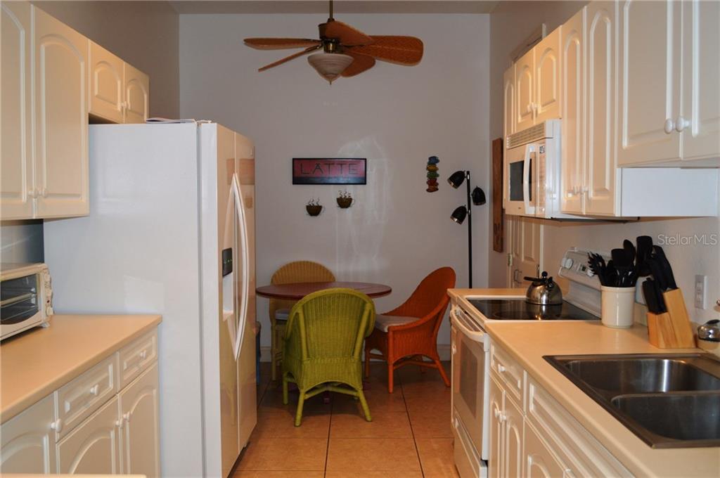 Kitchen with white cabinets and stainless steel appliances.