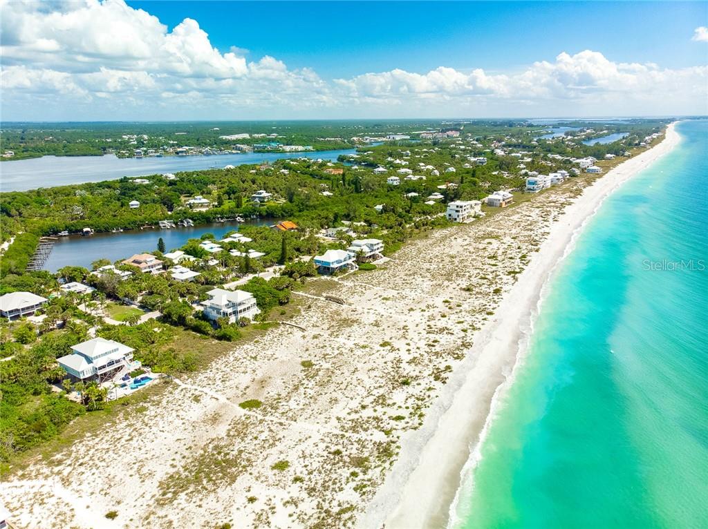 Aerial view of beach houses and coastline.