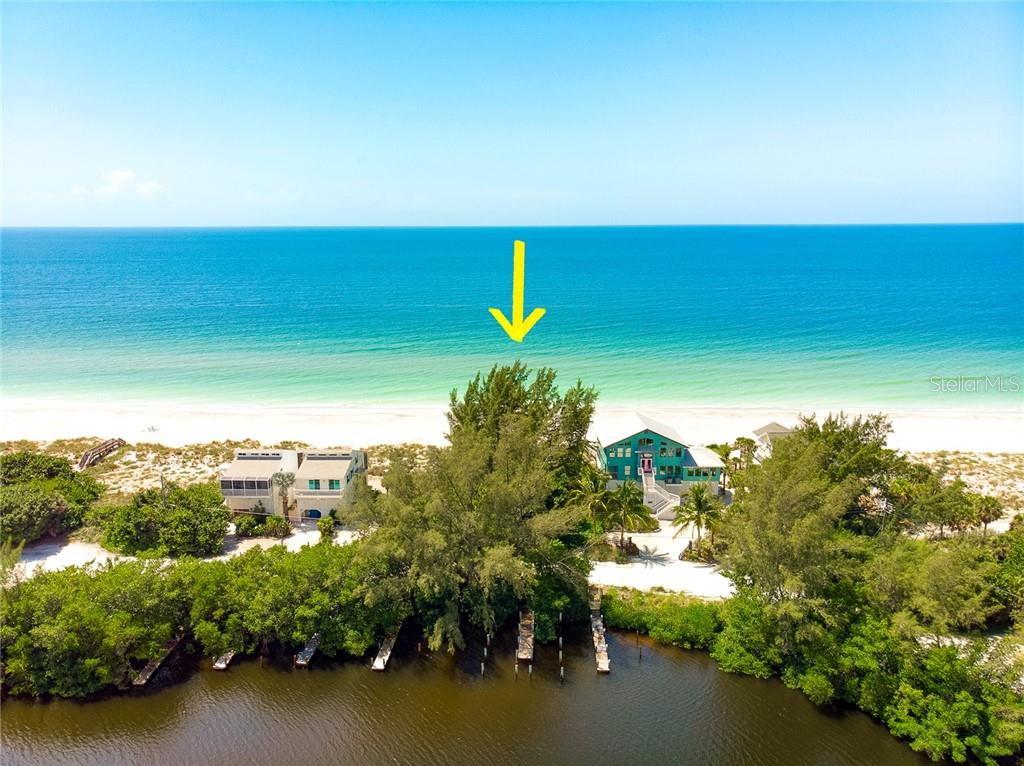 Beachfront home with boat dock.