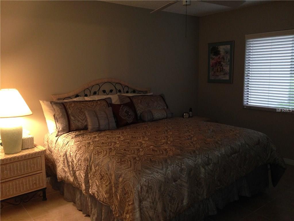 Bedroom with a bed and bedside table.