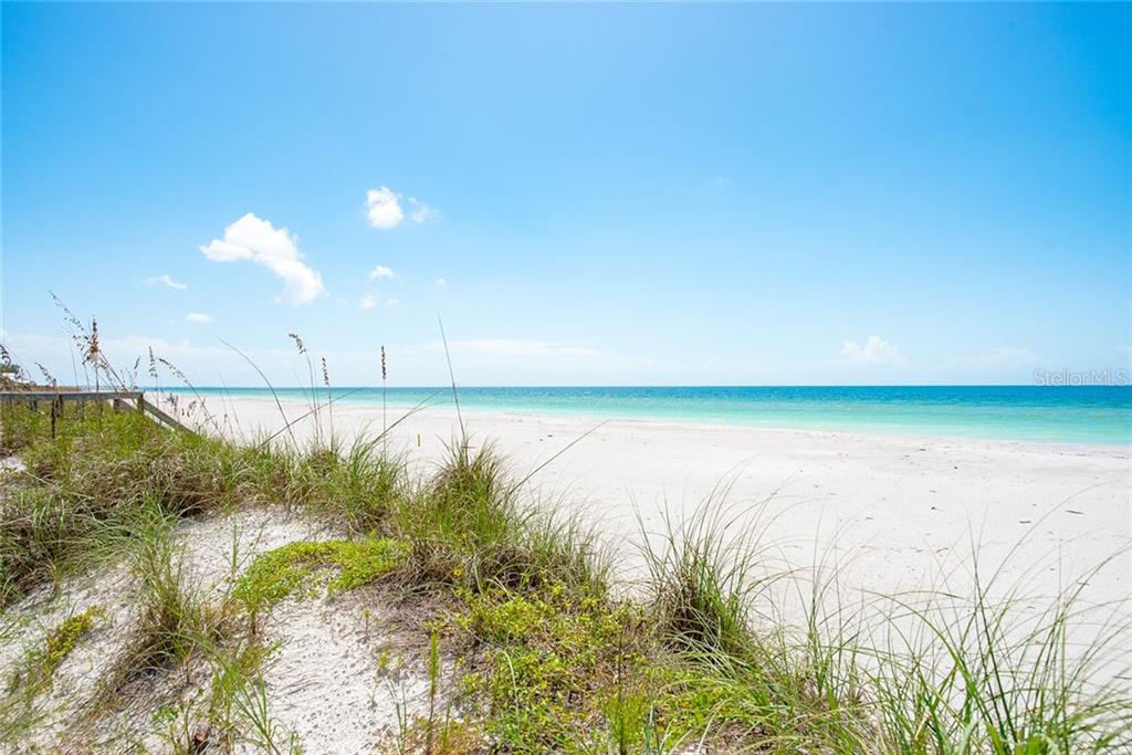 White sand beach with blue water.