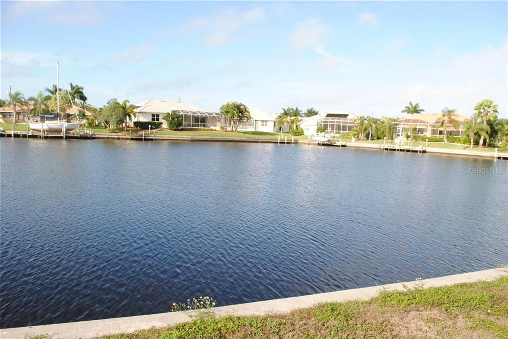 Waterfront view of homes and canal.