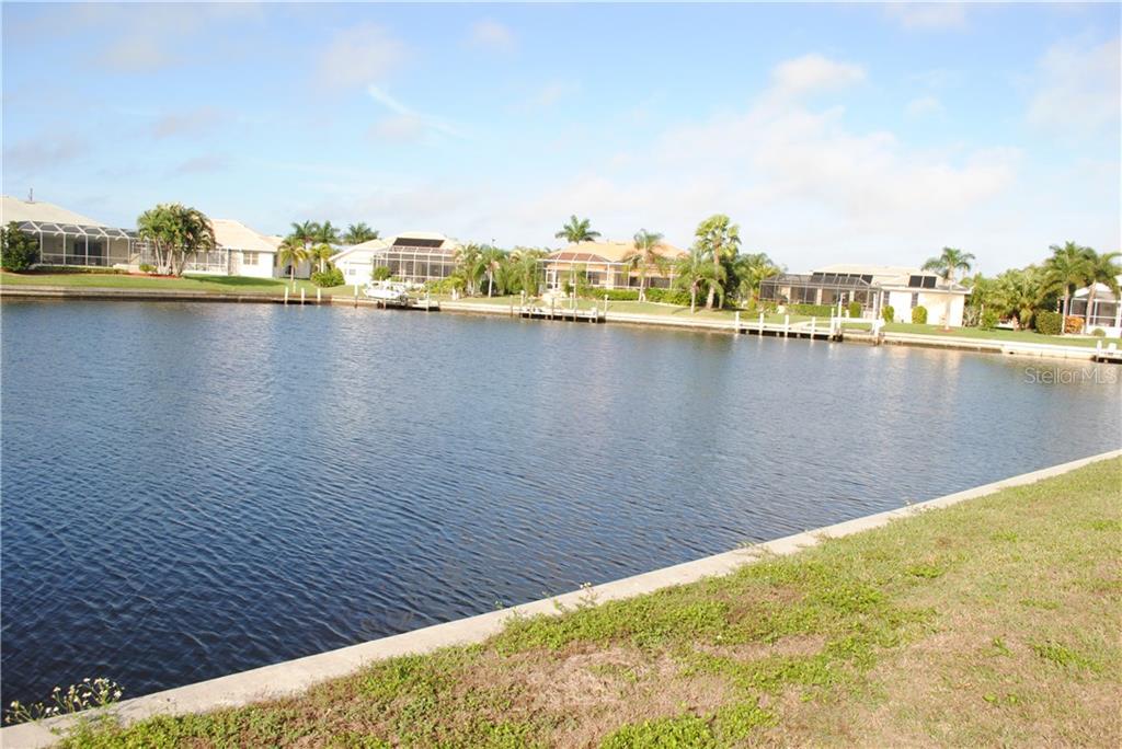 Waterfront view of homes and canal.