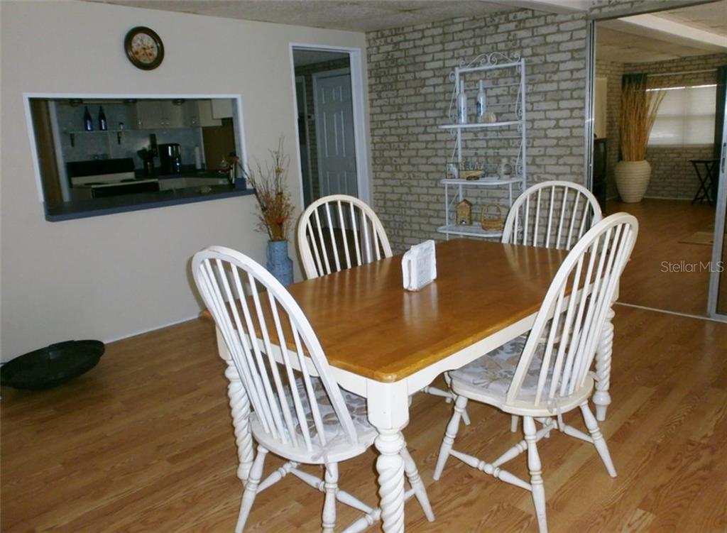 Dining room table and chairs in a house.