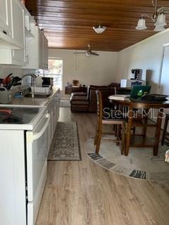 Kitchen and living room with wood floors.