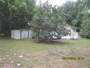 Backyard of a house with a shed.