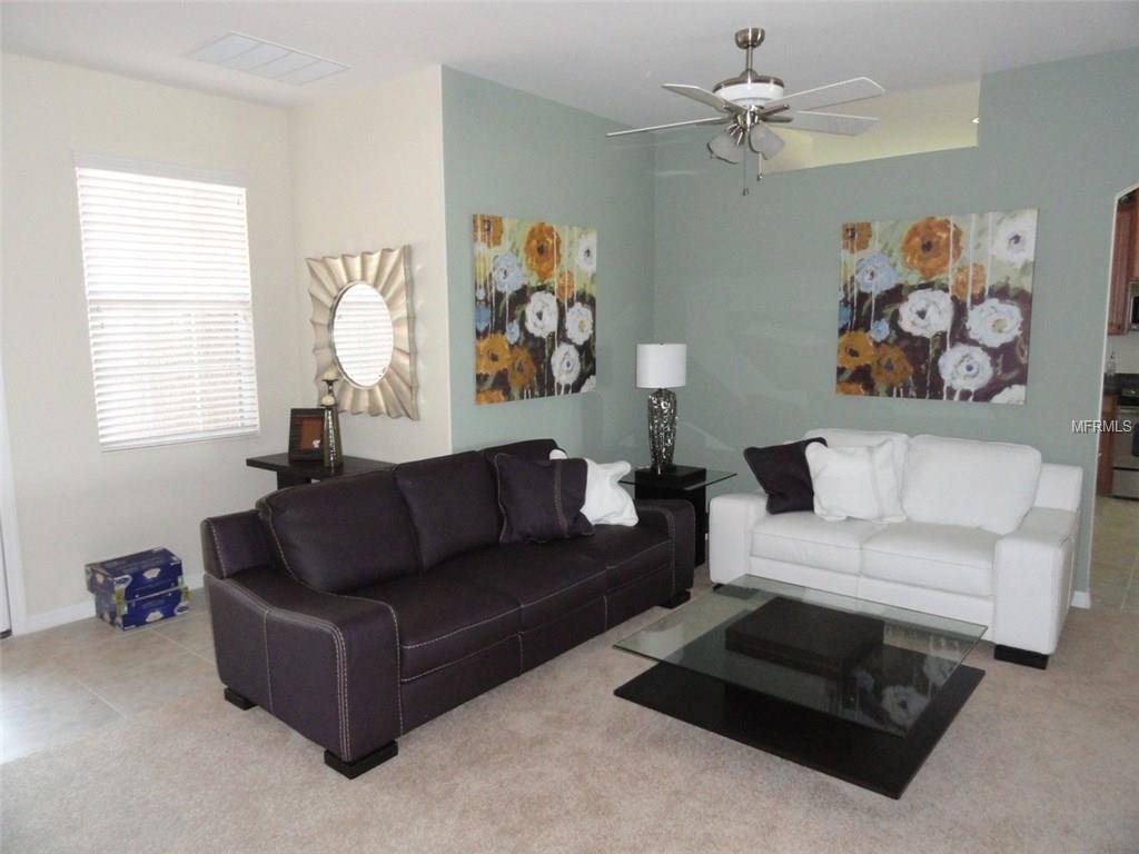 Living room with white and brown couches.