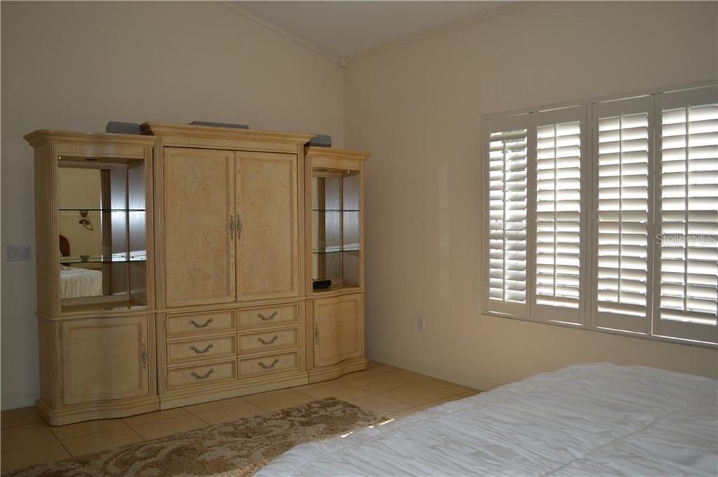 Wooden cabinet with drawers and shelves.