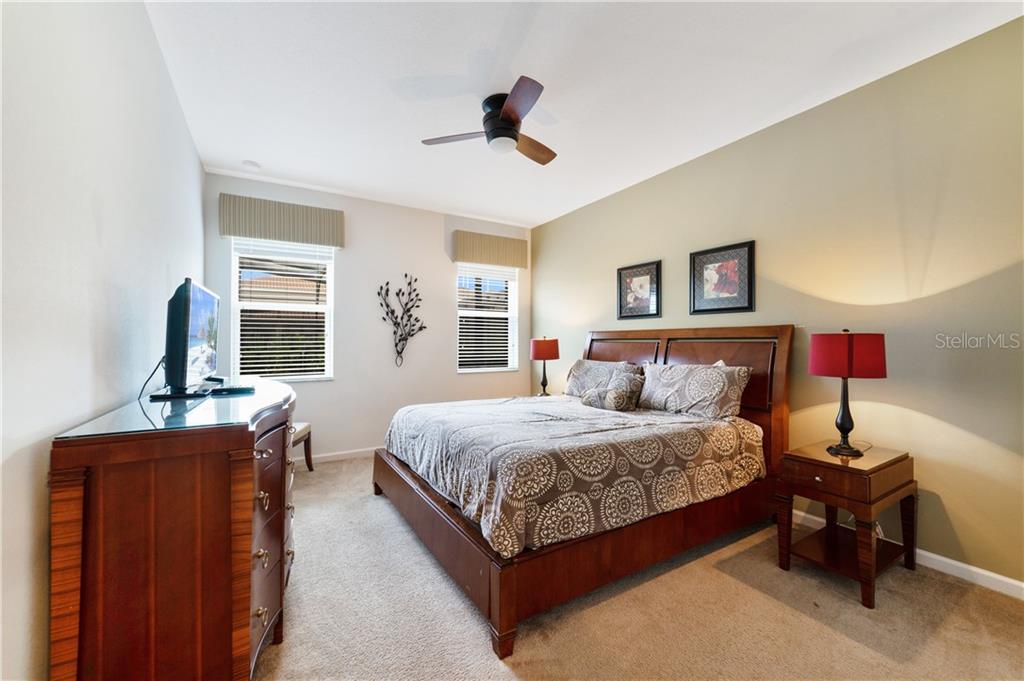 Bedroom with king size bed and nightstand.