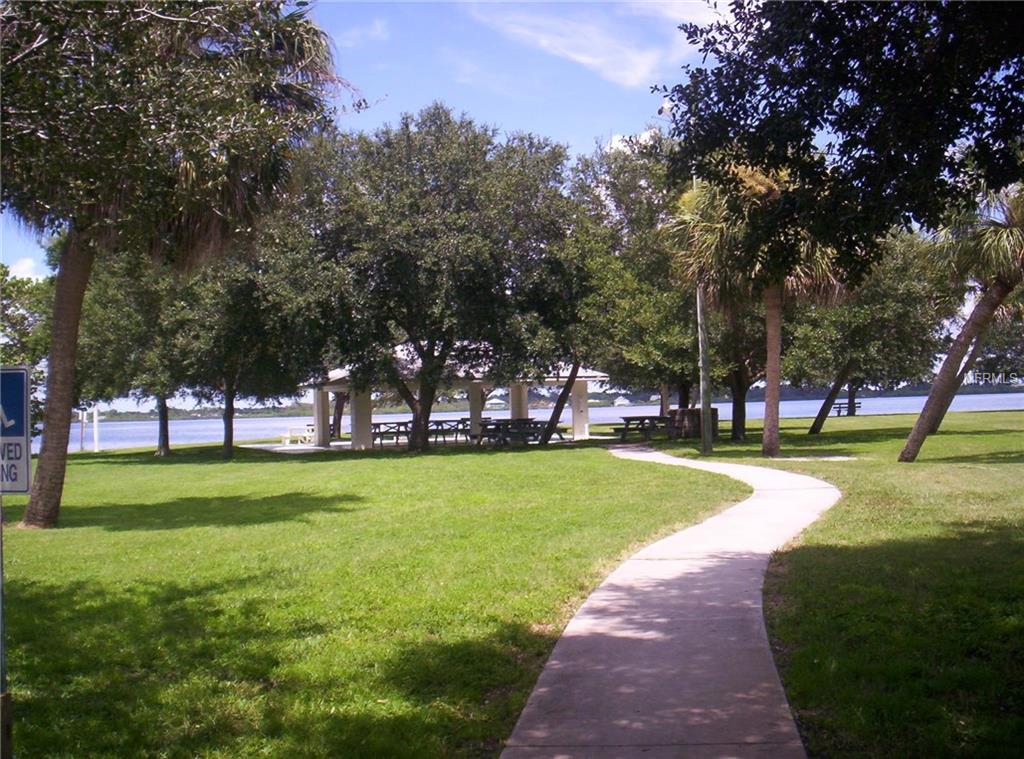 Park path leading to covered picnic area.