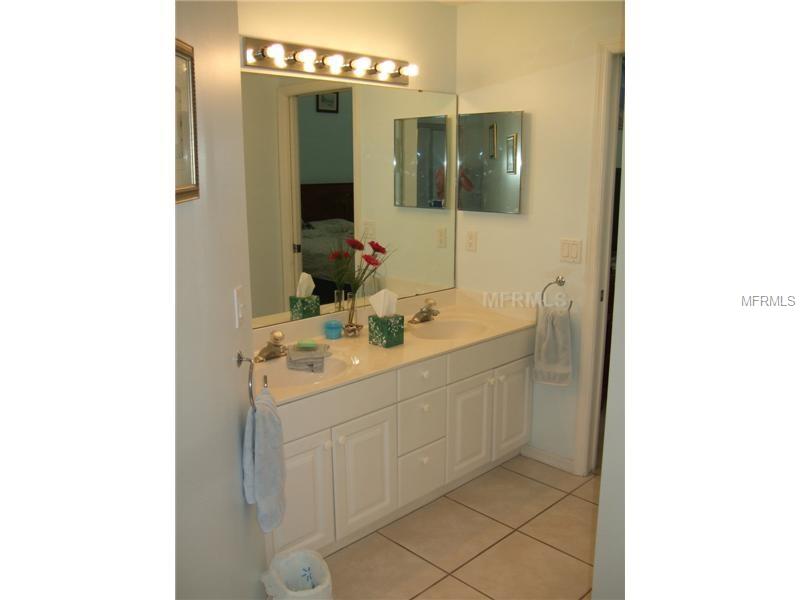 White bathroom vanity with double sinks.